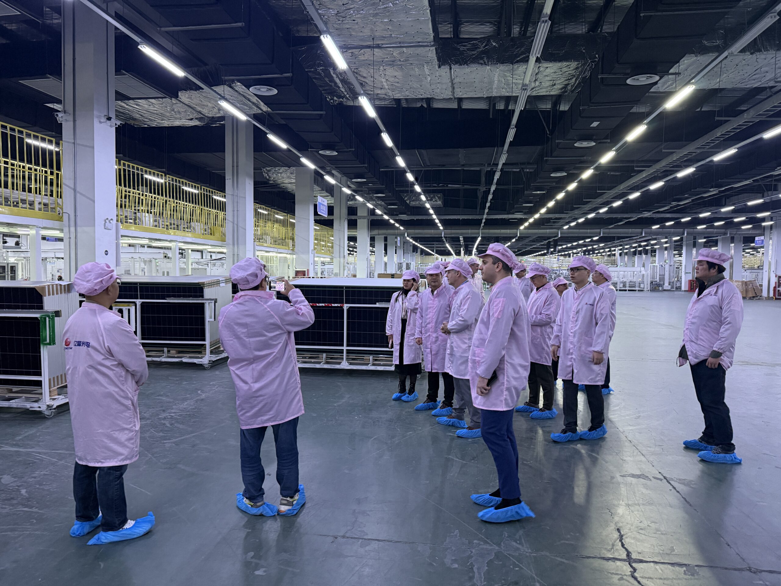 Delegation visiting a solar manufacturing facility during the 2025 Mission